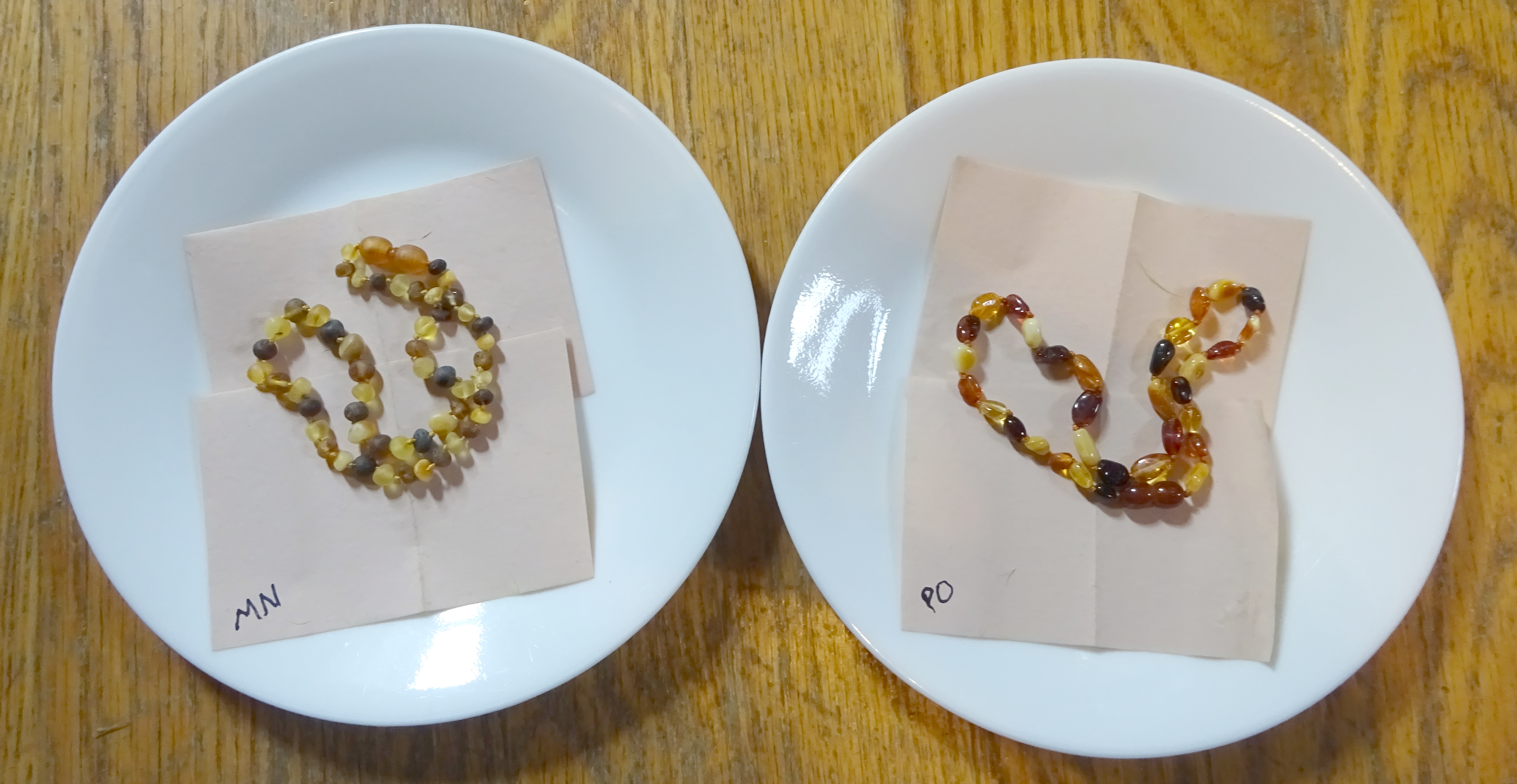 Necklaces on rice paper before going into the incubator.